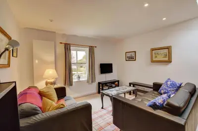 a living room with two couches and a tv at 2 Bed in Snape oc-sfoms in Snape