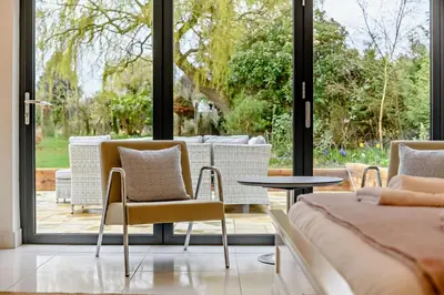 a room with two chairs and a table and a window at 4 Bed in Aldeburgh oc-12lr in Aldeburgh