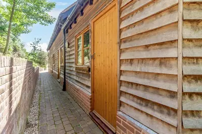 a wooden door on the side of a building at 2 Bed in Woodbridge oc-vav in Hollesley