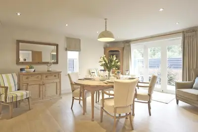 a kitchen and dining room with a table and chairs at 2 Bed in Thorpeness oc-vels in Thorpeness