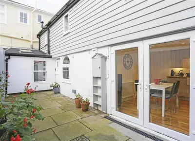 anterior view of a patio with sliding glass doors at 2 Bed in Aldeburgh oc-tsc in Aldeburgh