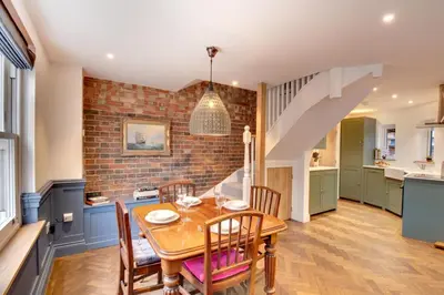 a kitchen and dining room with a table and chairs at 2 Bed in Woodbridge oc-zep in Woodbridge
