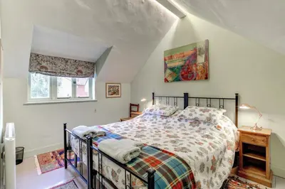 a bedroom with a bed in a attic at 3 Bed in Nr Aldeburgh oc-sfwws in Snape