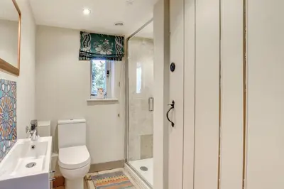 a bathroom with a toilet and a sink and a shower at 3 Bed in Nr Aldeburgh oc-sfwws in Snape