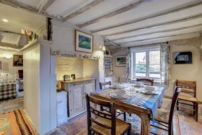 a kitchen and dining room with a table and chairs at 3 Bed in Nr Aldeburgh oc-sfwws in Snape