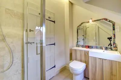 a bathroom with a toilet and a sink and a shower at 3 Bed in Nr Aldeburgh oc-sfwws in Snape