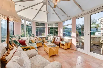 a living room filled with furniture and windows at 4 Bed in Halesworth oc-willho in Halesworth