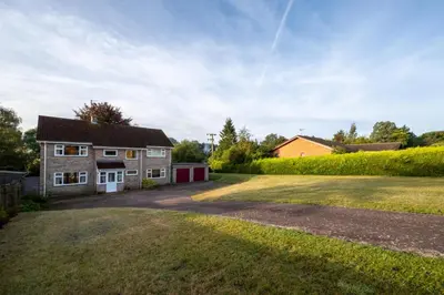 a house with a large yard in front of it at 4 Bed in Halesworth oc-willho in Halesworth