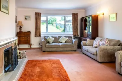 a living room with two couches and a fireplace at 4 Bed in Halesworth oc-willho in Halesworth