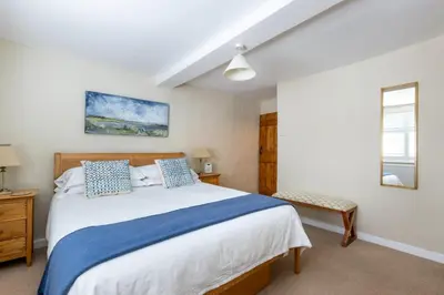 a bedroom with a large bed and a window at 2 Bed in Woodbridge oc-csn2 in Woodbridge
