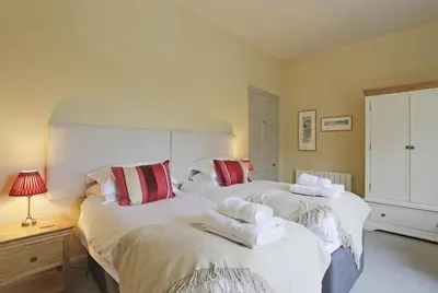 a bedroom with two beds with towels on them at 2 Bed in Orford oc-sfwco in Orford