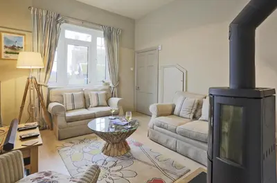a living room with a couch and a fireplace at 2 Bed in Orford oc-sfwco in Orford