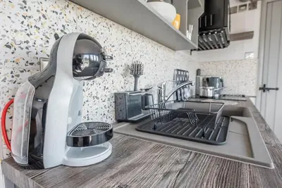 a kitchen with a dish washer on a counter at Lily Pad, Friston in Saxmundham
