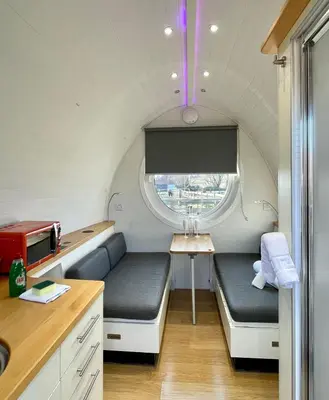 a small room with two beds and a window at Armadilla 1 at Lee Wick Farm Cottages & Glamping in Clacton-on-Sea