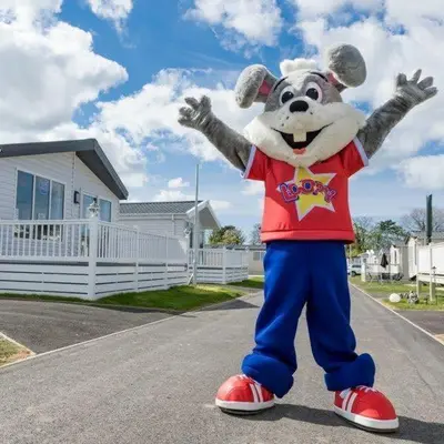 a person dressed in a mickey mouse costume at Arizona - Pura Vida Holidays Caravan in Clacton-on-Sea