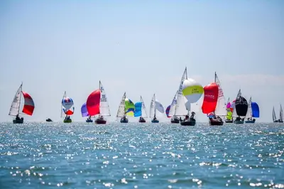 a large group of sailboats on the water at Harbour Walk in Brightlingsea