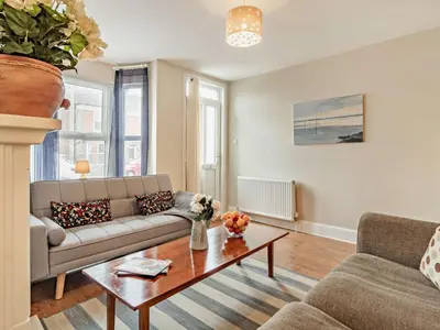 a living room with a couch and a coffee table at Harbour Walk in Brightlingsea