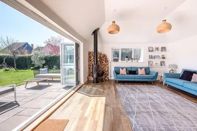 a living room with a couch and a fireplace at Springfield, Westleton in Westleton