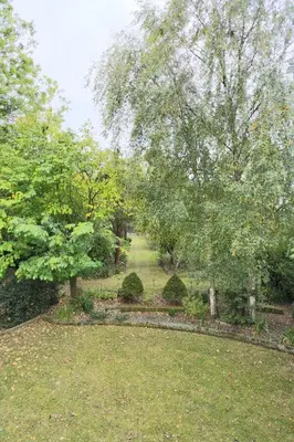 a garden with trees and shrubs in a park at 6 Bed in Lavenham oc-stofa in Lavenham