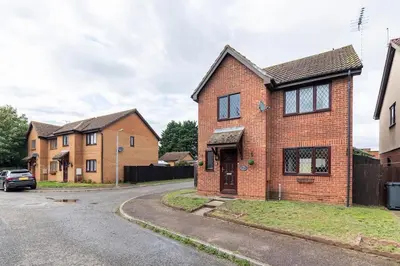 a brick house on a street with houses at House on cul de sac in Lakenheath