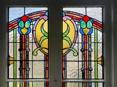 two stained glass windows in a room at Charming Seaside Cottage in Leigh-on-Sea in Southend-on-Sea